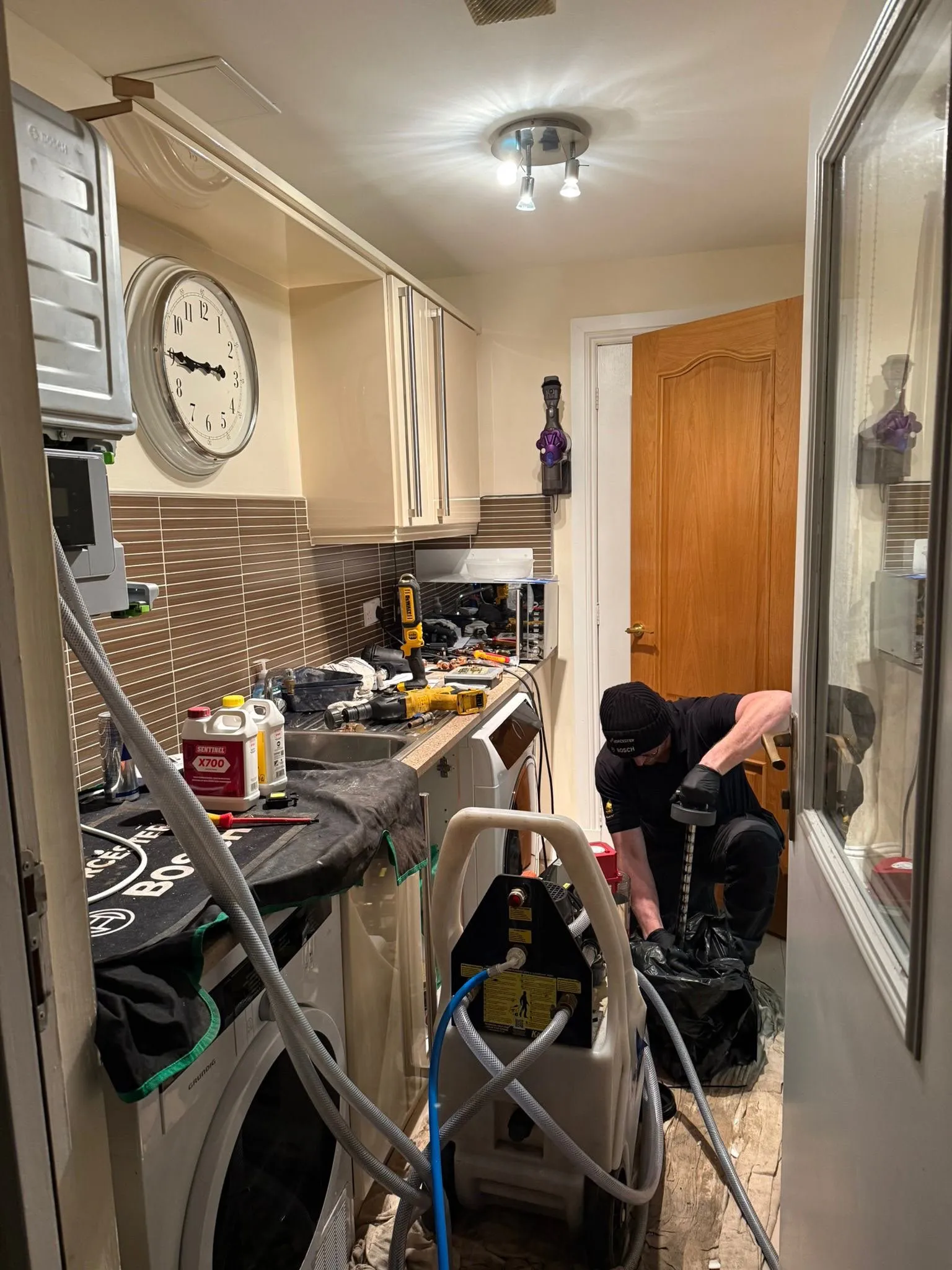 Engineer power flushing a central heating system