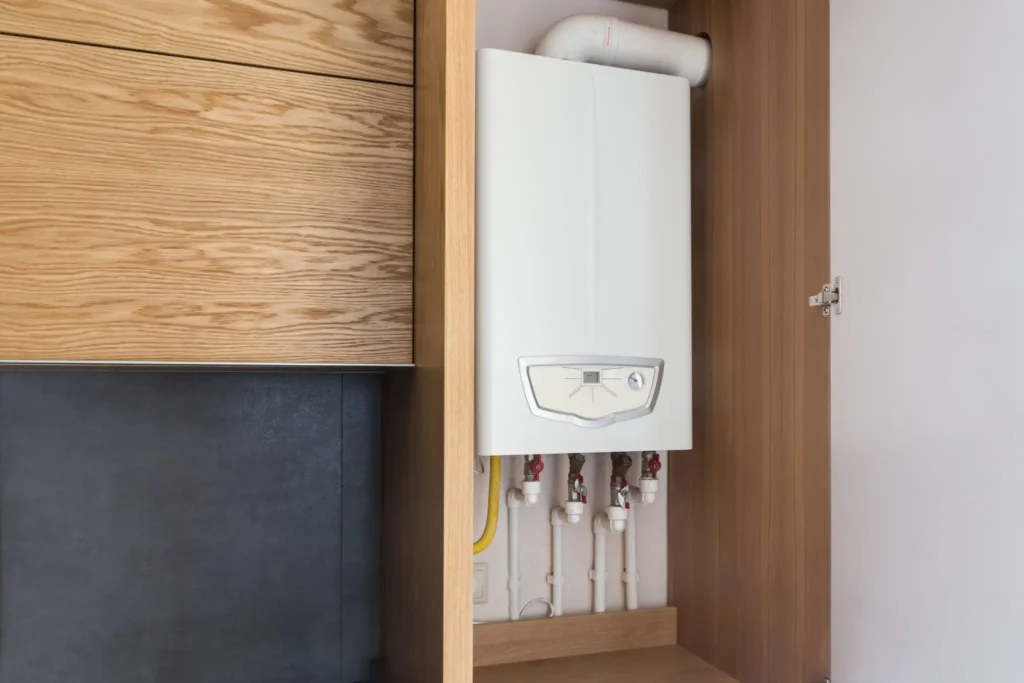boiler repairs motherwell 5 - Buchanan Gas & Heating Ltd Compact combi boiler neatly installed inside a wooden kitchen cabinet by Buchanan Gas & Heating – professional boiler repairs in Motherwell.
