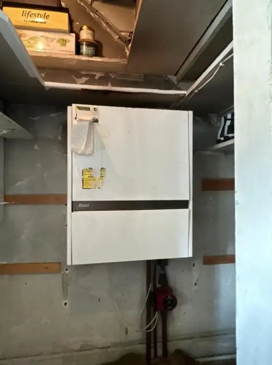 Old Baxi boiler system before replacement by Buchanan Gas and Heating, trusted for reliable boiler services in Coatbridge.