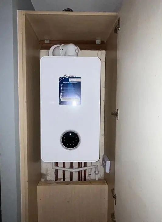 New Worcester Bosch boiler fitted inside a cupboard by Buchanan Gas and Heating, professional boiler services in Coatbridge.