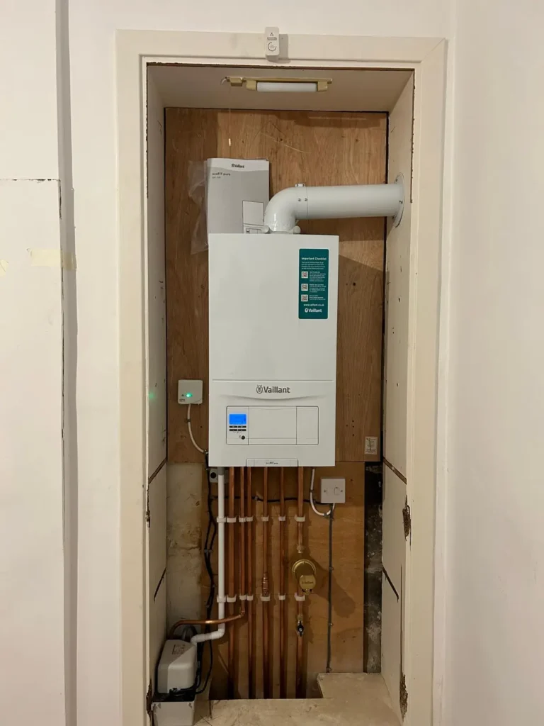 Vaillant boiler installation with precise copper pipework in recessed cupboard space | Buchanan Gas and Heating